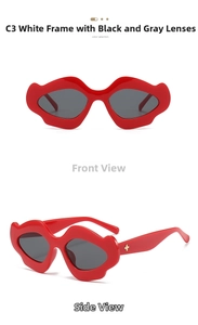 Detail of red lip-shaped sunglasses featuring dark grey lenses and gold star hardware