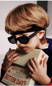 Kids black polarized sunglasses with UV protection shown on a model for outdoor style