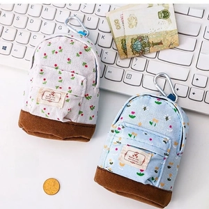 Mini floral canvas coin purse backpack style with metal carabiner and compact design