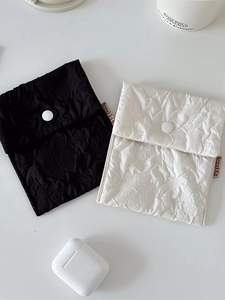 Floral textured portable storage pouches for sanitary pads and small accessories