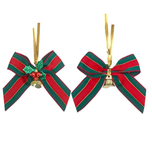 Detailed view of red and green striped Christmas bows with gold bells and holly berries