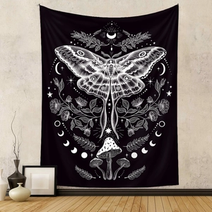 Bohemian black wall tapestry featuring white moth mushroom moon and stars in room setting