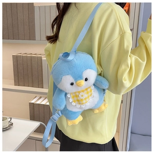 Detailed back view of a plush blue penguin backpack with adjustable straps on a model