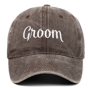 Close-up of white Groom embroidery on a vintage washed cotton baseball cap