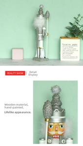 Detail view of 40cm silver wooden nutcracker king with plush trim and manual painting finish