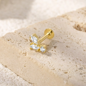 Macro view of gold S925 silver butterfly labret stud with sparkling zircon gemstones