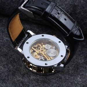 Close-up of skeleton automatic mechanical watch movement through transparent case back
