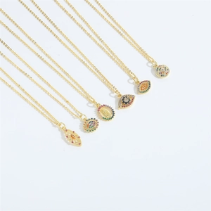 Golden evil eye pendant necklaces with colorful cubic zirconia in bohemian style