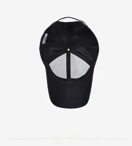 Detailed view of the internal lining and stitching of a black men's baseball cap