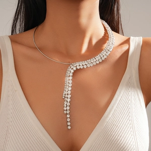 Macro shot of silver rhinestone tassel choker necklace with dangling zircon details