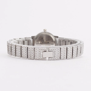 Back view of silver quartz watch for women with textured metal strap and rhinestone details