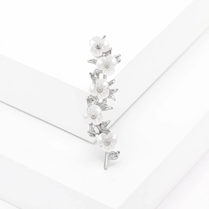Silver plum blossom branch brooch featuring delicate white floral petals on white props