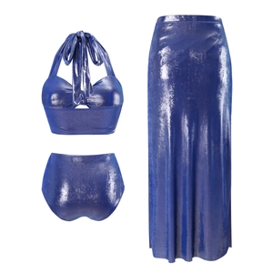 Detailed view of shiny blue three-piece swimsuit set with halter top and slit skirt