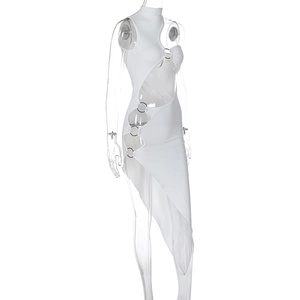 Detail of white cutout dress showing silver metal ring connectors and asymmetric tailoring