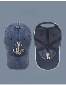 Detailed view of navy washed cotton baseball cap with anchor embroidery and metal buckle