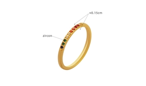 Detailed view of gold zircon ring with 0.15cm colorful stones and polished band finish