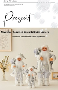 Three silver sequin Santa figurines with lanterns in various sizes for Christmas decor