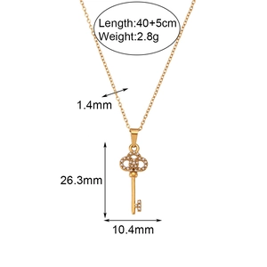 Titanium steel gold key pendant necklace with white bead inlays and size measurements