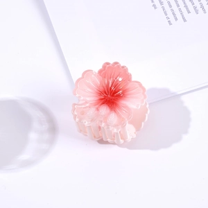 Close-up of a 4.5cm pink gradient flower hair claw clip on a clean white background