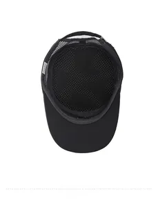 Close-up of breathable mesh lining and adjustable strap inside a black flat top cap