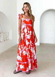 Red floral maxi dress with scalloped pink edges and tie-up shoulder straps