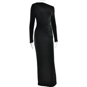 Detail of the glittering black fabric and twisted ruching on an off-shoulder dress