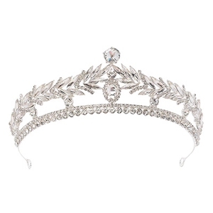 Detailed close-up of a silver bridal crown with intricate crystal leaf patterns
