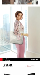 Close-up of minimalist white Oxford fabric tote bag with slender straps and smooth texture