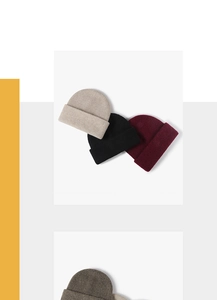 Detailed knit texture of solid color winter beanies in beige, black and burgundy
