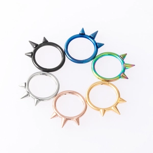 Septum ring set with spikes in black, gold, and silver finishes for body piercing