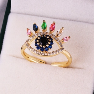 Macro detail of evil eye ring with colorful zircon stones in a velvet jewelry box
