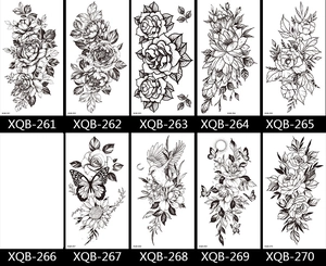 Detailed catalog showing ten black and white floral tattoo stickers with rose and bird designs