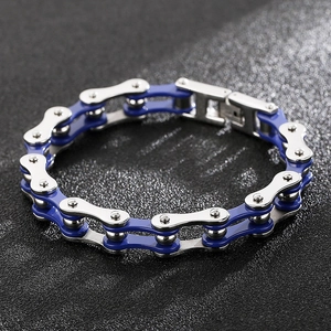 Macro detail of industrial bike chain bracelet in blue and silver polished stainless steel