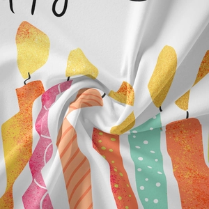 Detailed macro view of woven fabric texture with vibrant birthday candle patterns