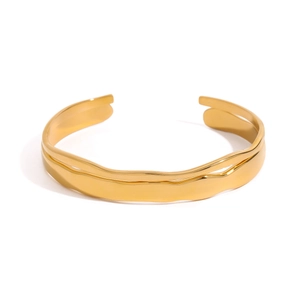 Minimalist gold stainless steel open cuff bracelet with sleek wavy textured design