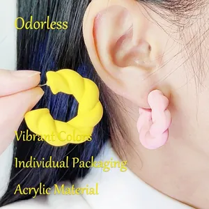 Exaggerated C-shaped twisted acrylic hoop earrings in pink and yellow macaron tones
