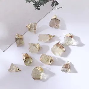Natural birthstone pendants with gold plated edges and raw crystal mineral textures