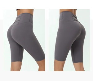 Detail of high waisted yoga shorts featuring unique crisscross back design in charcoal grey