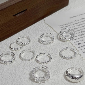 Macro view of 925 sterling silver ring set featuring diverse textures and patterns