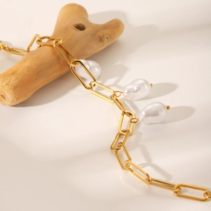 18K gold plated stainless steel chain bracelet featuring three baroque pearl drops