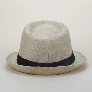 Close-up of beige woven straw jazz hat featuring a black satin ribbon band and texture