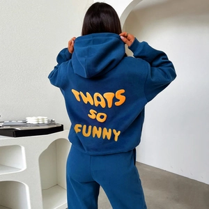 Detail of blue hoodie featuring orange 3D foam printed text on the back view