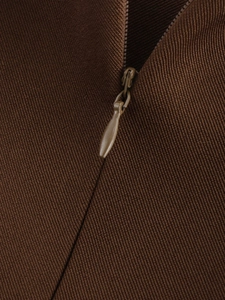 Detail of dark brown hidden zipper on high-density twill fabric for premium finish