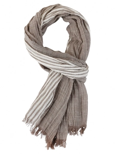 Detail of thin striped scarf with linen texture and fringe edges on a white background