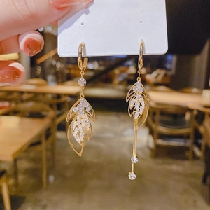 Asymmetric gold leaf dangle earrings with zircon crystals and long elegant chains