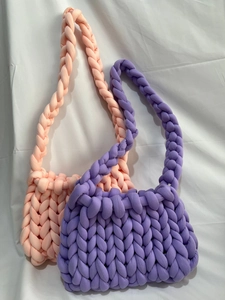Close-up of thick cotton tube yarn woven bags in peach pink and lavender purple