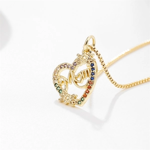 Golden heart necklace with MOM lettering and colorful zircon stones on white background