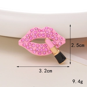 Pink rhinestone lip and lipstick accessory charm with 2.5cm by 3.2cm dimensions