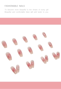 Detail of pink gradient long ballerina press-on nails with sparkling rhinestones decoration