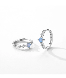 Detail of S925 sterling silver hoop earrings with light blue gemstone and zircon stones